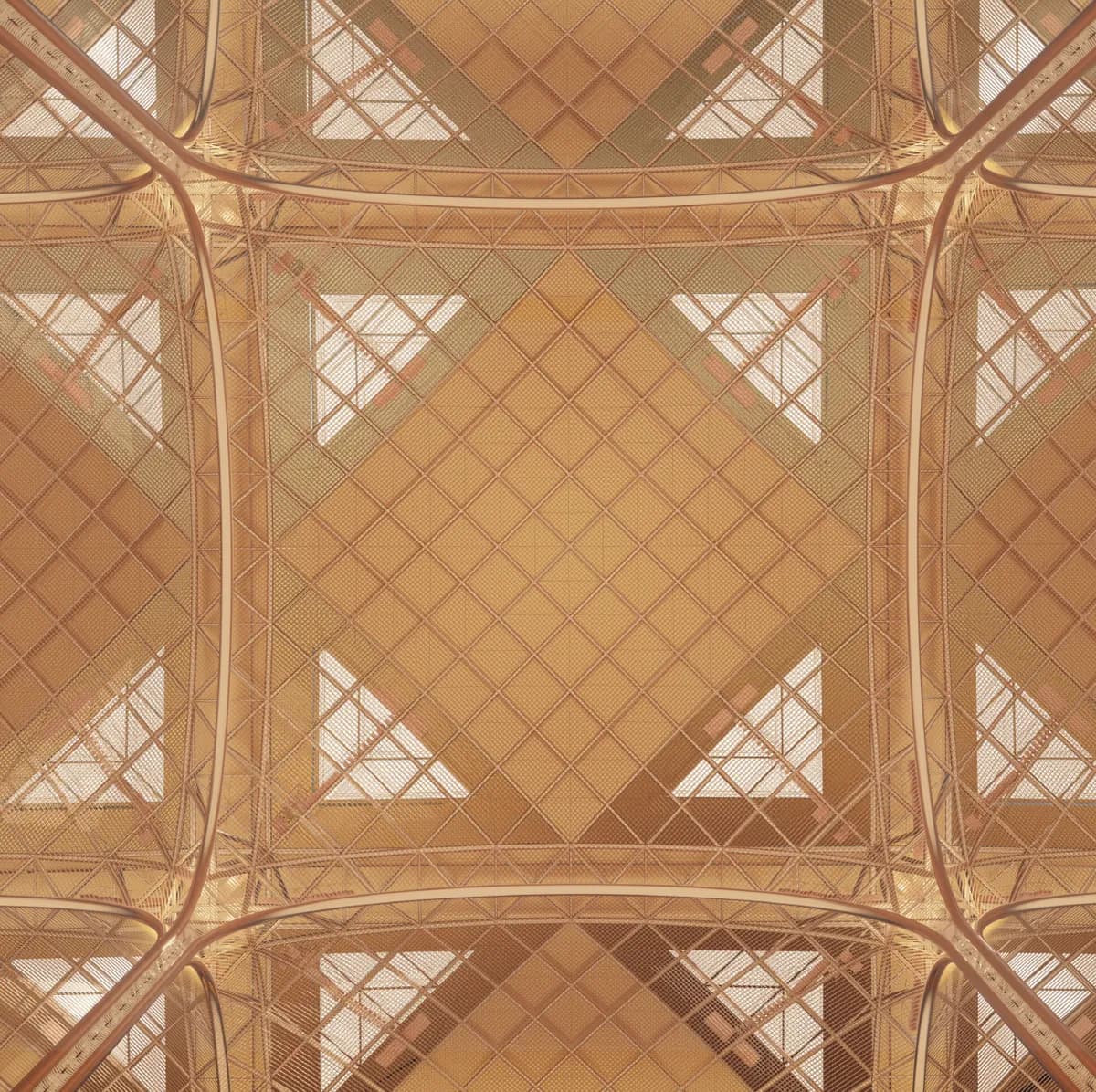 Looking up into the latticed ceiling where four vaults meet