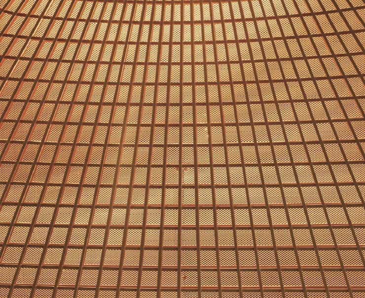 A latticed ceiling curving overhead