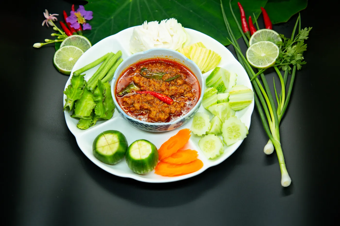 A chilli dip with cucumber, carrot, lime and herbs