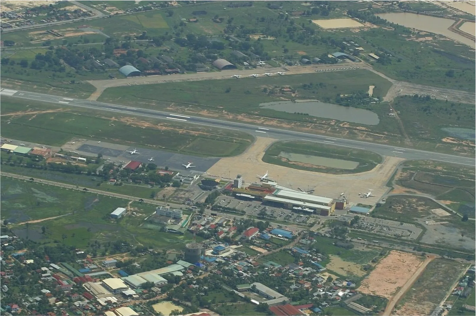 The airport and its runway from the air