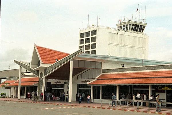 The terminal's red roofs beside the control tower