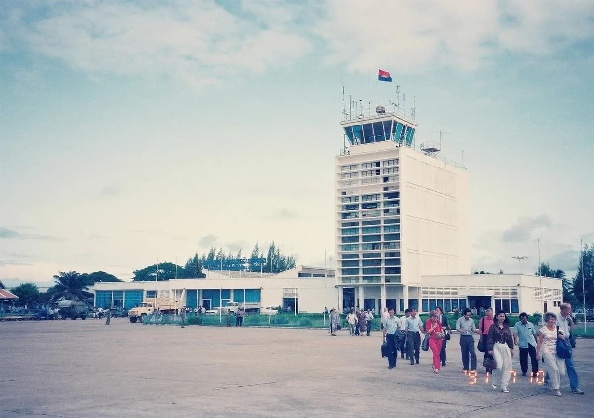 Passengers on the apron below Pochentong's control tower