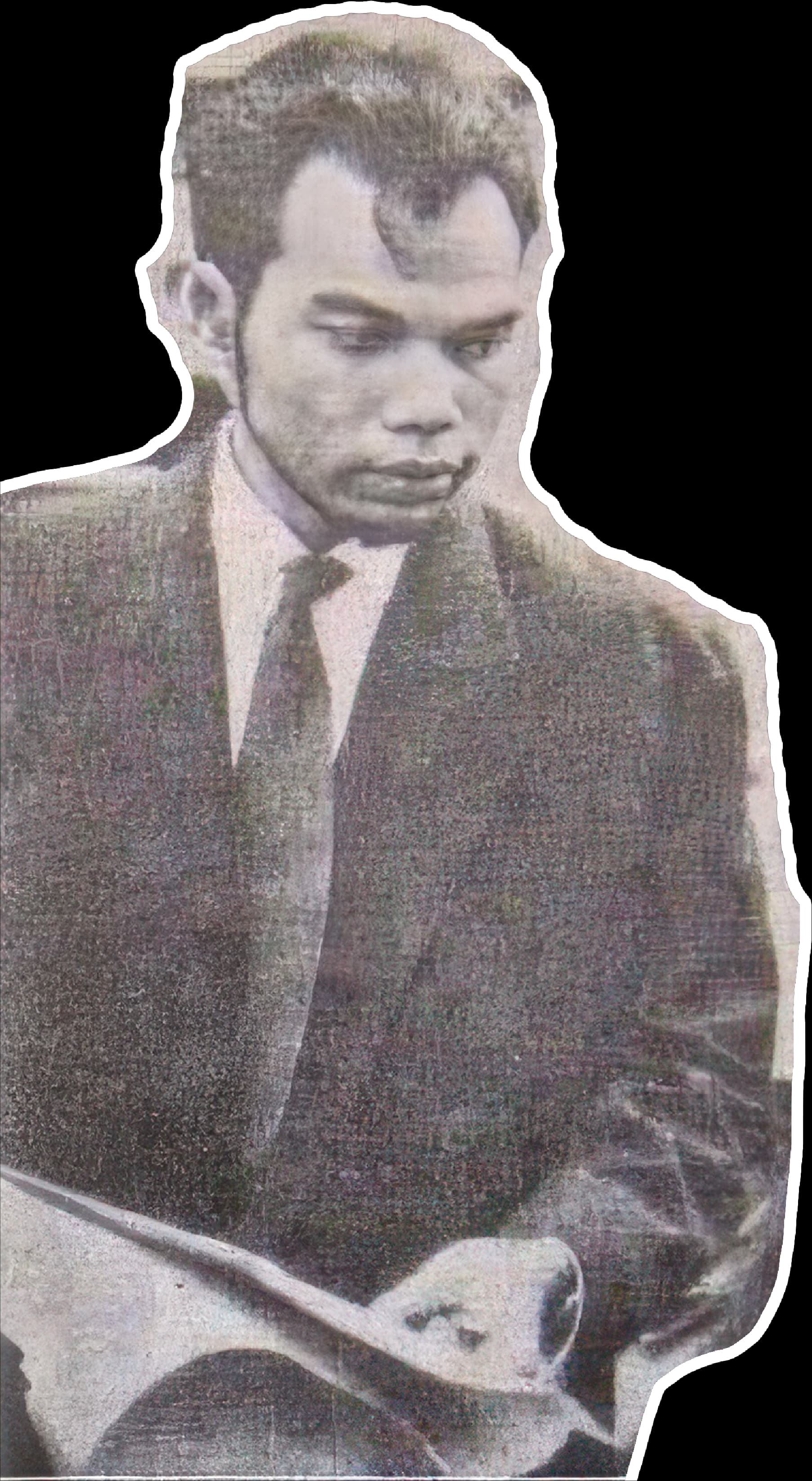 Vann Molyvann as a young architect, looking down at a drawing in his hands
